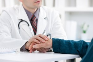 doctor-holding-hand-during-procedures-for-elderly-patients