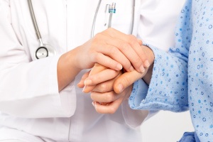 doctor-holding-hand-patient-centered-care
